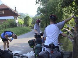 A welcome water stop at the public fountain at Chapelle du Roc, Le Bu, 49.0 miles into the ride